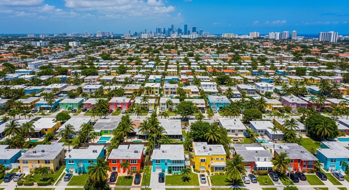 Contractor marketing services in Hialeah, Florida with Miami-Dade residential neighborhood homes and Miami skyline backdrop
